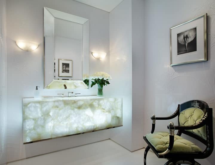 Custom built White Quartz Semi-precious vanity with integrated sink, and specially designed backlight feature.